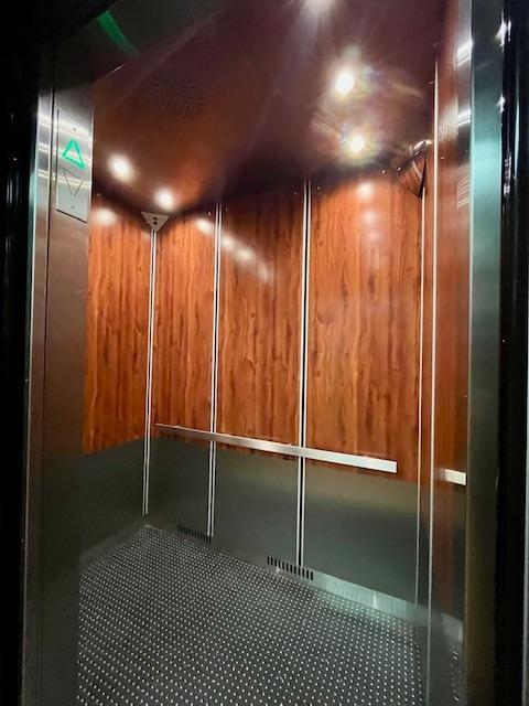 2270 Plumb 1st St Unit 4F, Brooklyn, NY 11229 - interior space with elevator and wooden walls