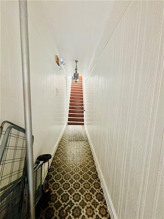 hallway with tile patterned floors