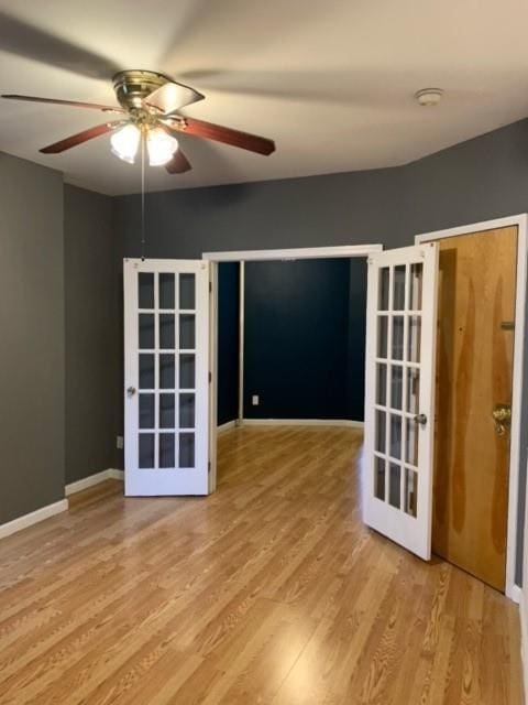 spare room with ceiling fan and light hardwood / wood-style flooring