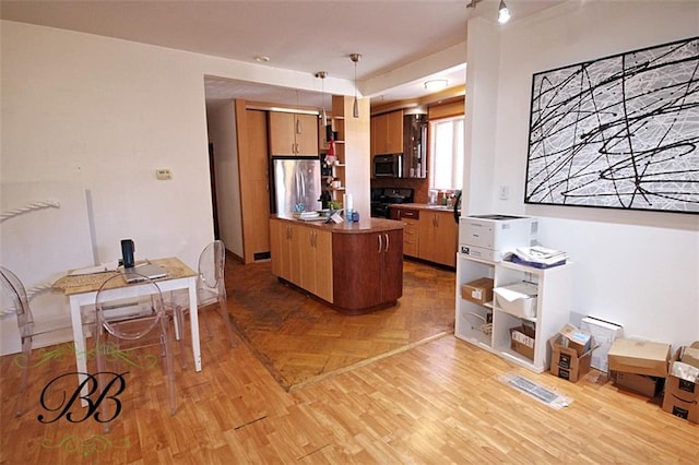 226 W End Ave, New York, NY 11235 - kitchen featuring stainless steel appliances, open shelves, brown cabinetry, and parquet floors