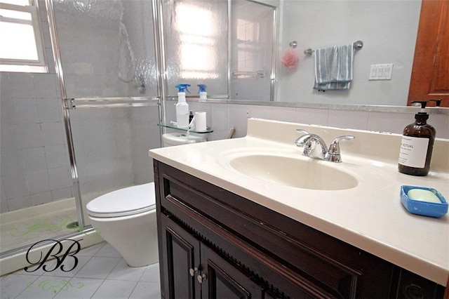 226 W End Ave, New York, NY 11235 - full bathroom with vanity, tile patterned flooring, a shower stall, and toilet