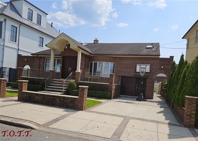 view of front facade featuring an attached garage, roof with shingles, concrete driveway, and brick siding