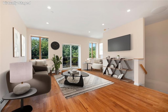 living room featuring recessed lighting and wood finished floors