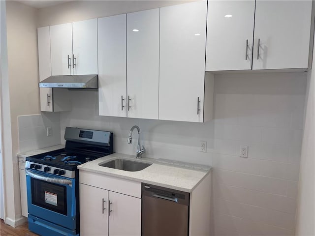 1171 86th St Unit 1B, Brooklyn, NY 11228 - kitchen with stainless steel appliances, ventilation hood, white cabinets, and light stone counters