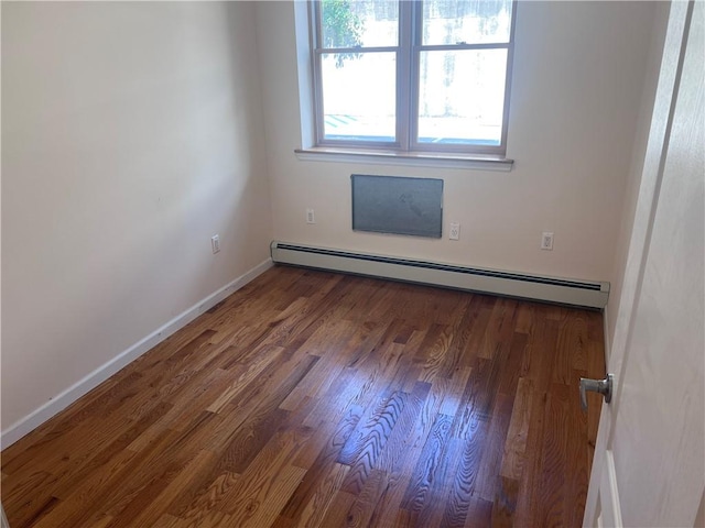 1171 86th St Unit 1B, Brooklyn, NY 11228 - empty room featuring a baseboard heating unit and wood finished floors