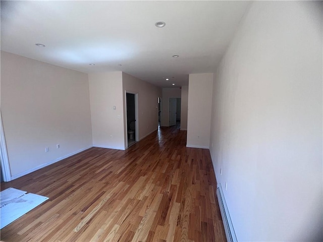 1171 86th St Unit 1B, Brooklyn, NY 11228 - spare room featuring baseboard heating, light wood finished floors, and recessed lighting
