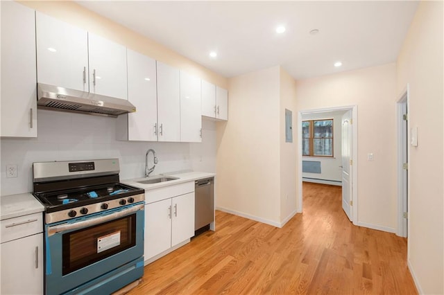 1171 86th St Unit 1B, Brooklyn, NY 11228 - kitchen featuring stainless steel appliances, exhaust hood, white cabinets, light countertops, and recessed lighting