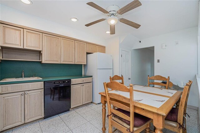 kitchen featuring sink, ceiling fan, black dishwasher, white refrigerator, and light brown cabinetry