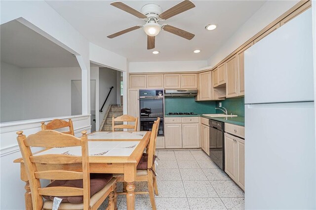 kitchen with sink, ceiling fan, black appliances, tile countertops, and light brown cabinets