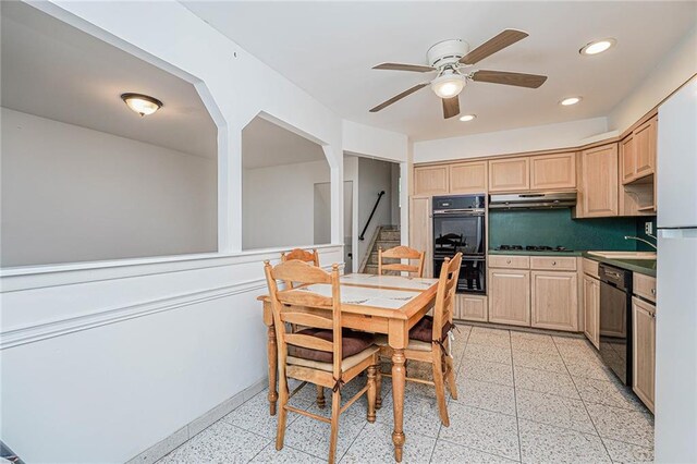 kitchen featuring light brown cabinetry, black appliances, and ceiling fan