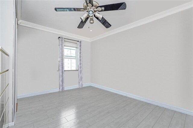 spare room featuring crown molding, ceiling fan, and light wood-type flooring