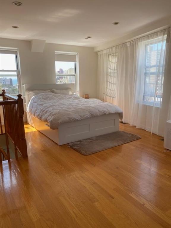 bedroom with light hardwood / wood-style floors