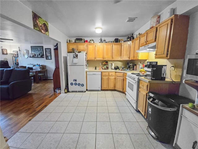 kitchen with ceiling fan, light wood-type flooring, and white appliances