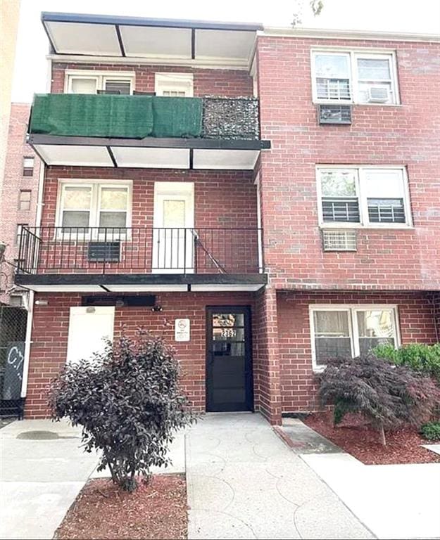 view of front of home with a balcony