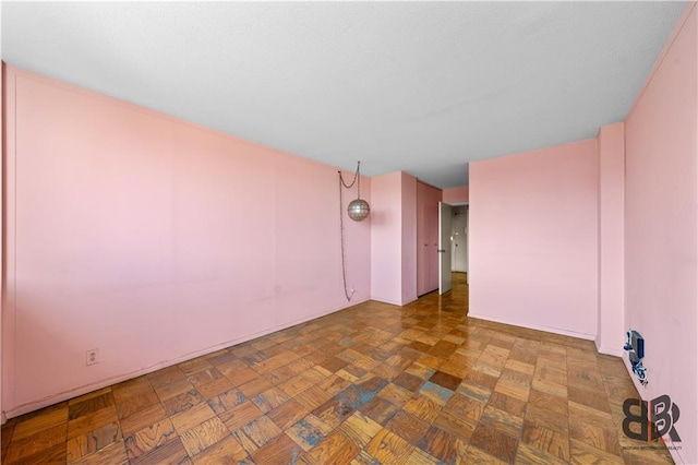 spare room with parquet flooring