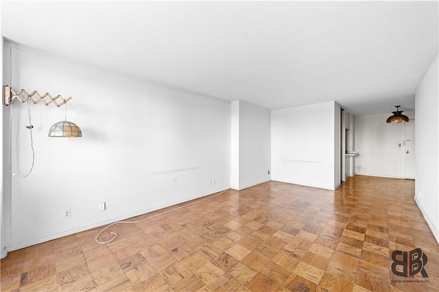 unfurnished room with light parquet flooring