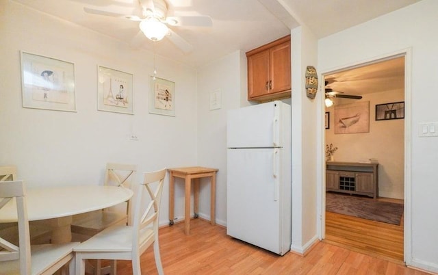 kitchen with ceiling fan, light hardwood / wood-style flooring, and white refrigerator