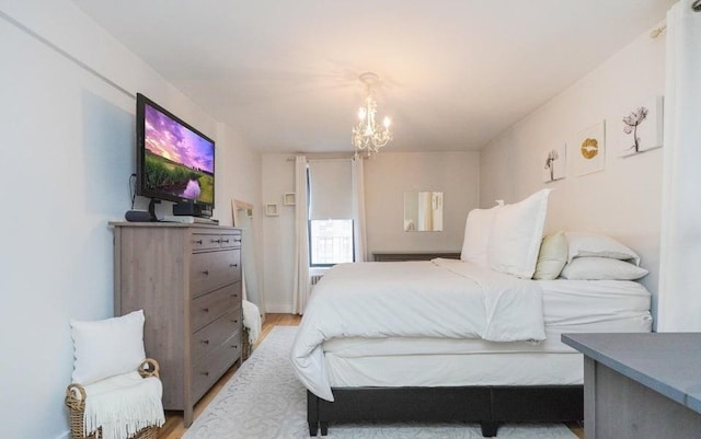 61 Oliver St Unit 2V, Brooklyn, NY 11209 - bedroom featuring light wood-style floors and a chandelier