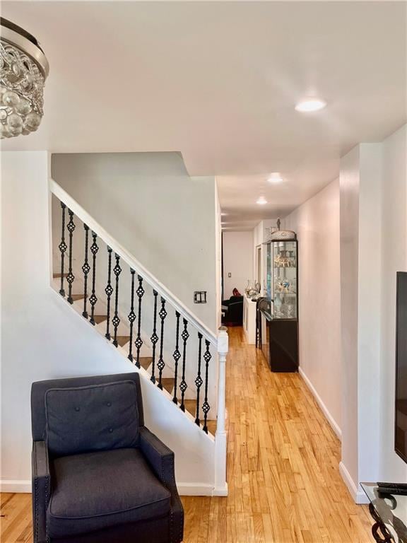 staircase with wood-type flooring