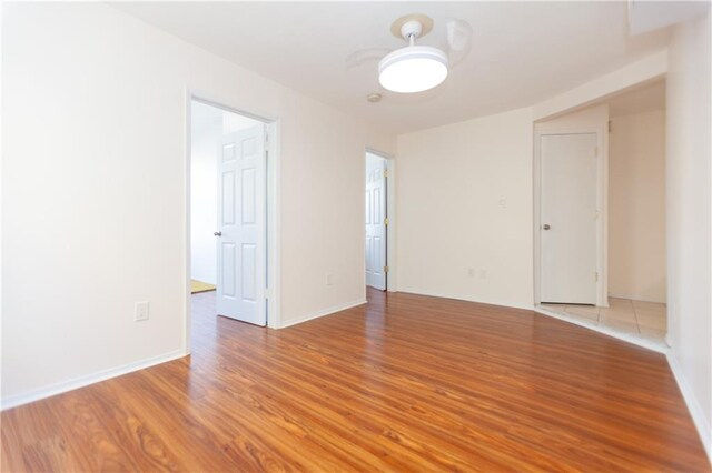 spare room featuring light hardwood / wood-style floors