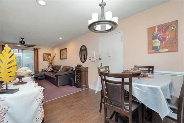 dining room with dark wood-type flooring and ceiling fan