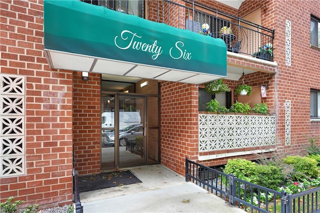 entrance to property with brick siding