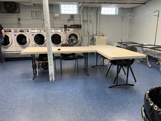 clothes washing area with a wealth of natural light and independent washer and dryer