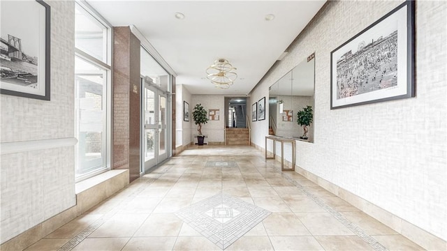 hall with light tile patterned flooring