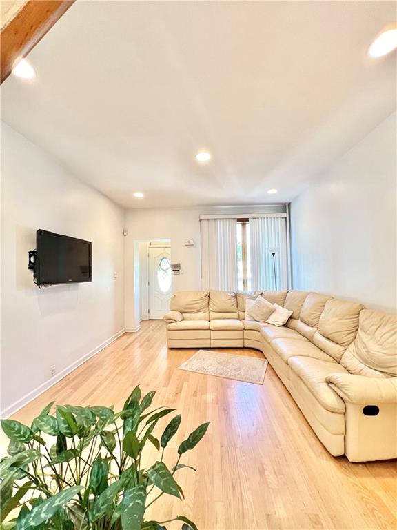 unfurnished living room featuring wood-type flooring