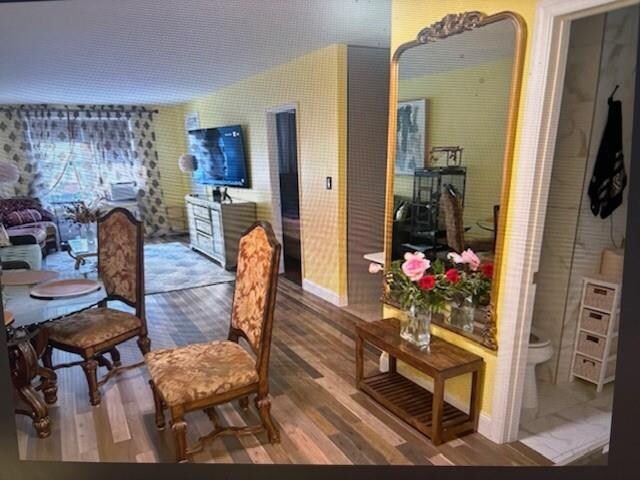 dining space featuring hardwood / wood-style floors