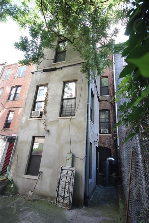 view of side of home with cooling unit