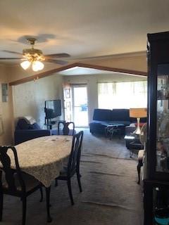 dining room featuring carpet floors and ceiling fan