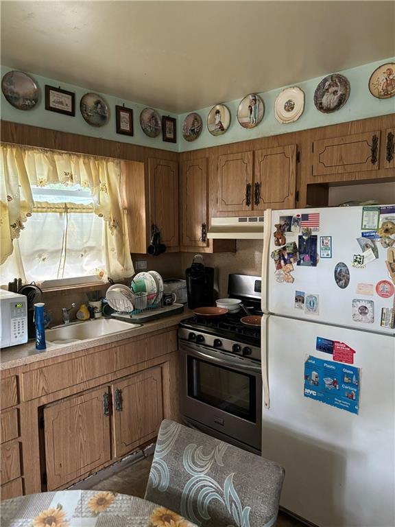 kitchen with white appliances and sink