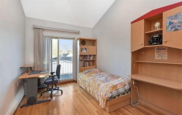 bedroom featuring vaulted ceiling, access to exterior, light hardwood / wood-style floors, and baseboard heating