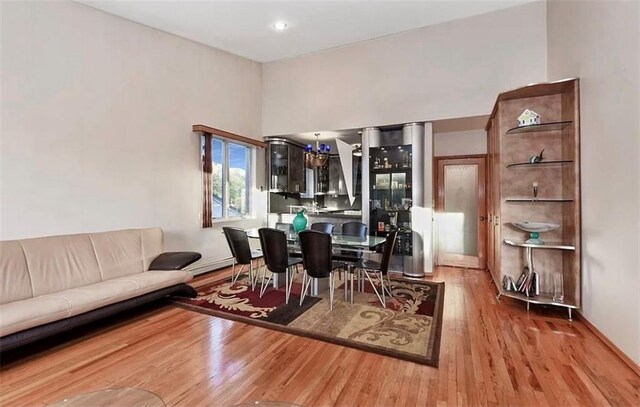 dining area with wood-type flooring