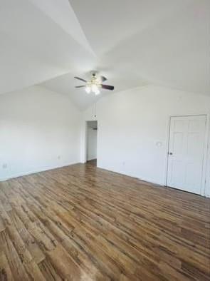 bonus room featuring vaulted ceiling, ceiling fan, and dark hardwood / wood-style flooring