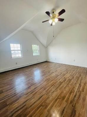 additional living space with ceiling fan, dark wood-type flooring, and lofted ceiling