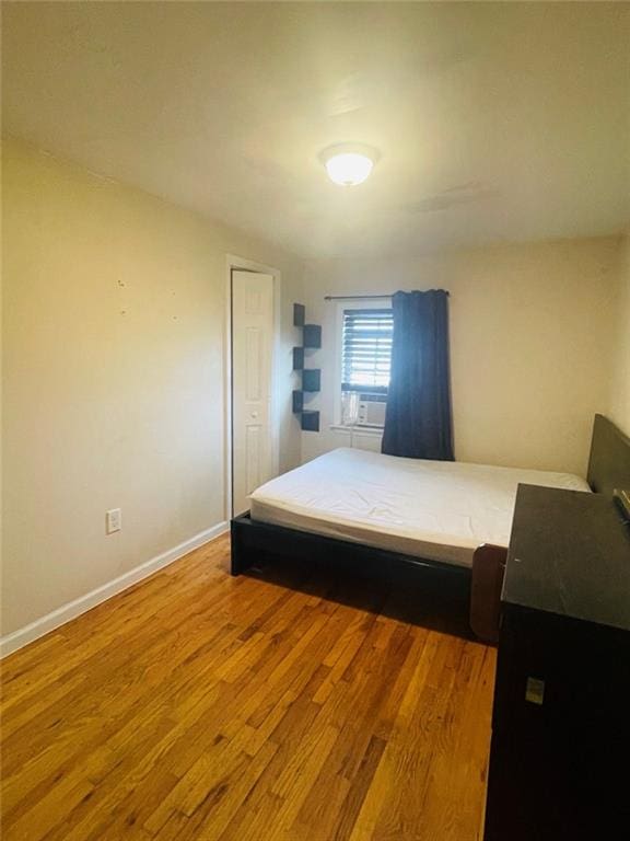 bedroom featuring wood-type flooring