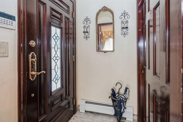 foyer entrance featuring a baseboard radiator