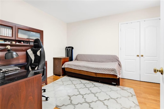 bedroom featuring light wood-style flooring