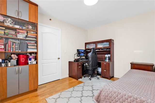 728 Ocean View Ave Unit A2, Brooklyn, NY 11235 - bedroom with wood finished floors, an office area, and baseboards