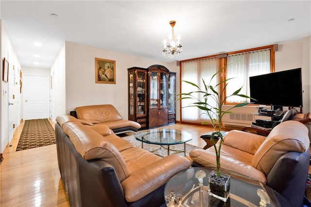 728 Ocean View Ave Unit A2, Brooklyn, NY 11235 - living room featuring a chandelier and light wood-style flooring