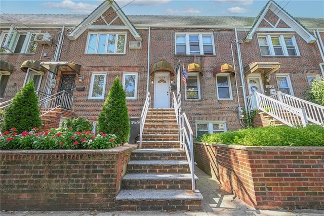 view of front of house with brick siding