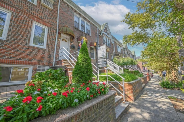 exterior space with brick siding