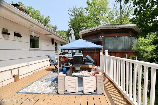 wooden terrace with a gazebo