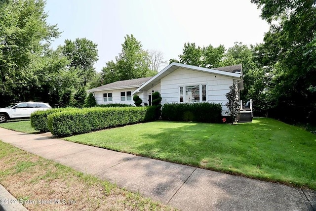 ranch-style house with a front lawn