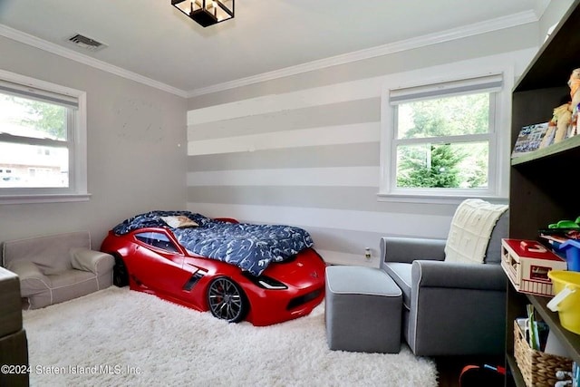 bedroom featuring ornamental molding, multiple windows, visible vents, and carpet