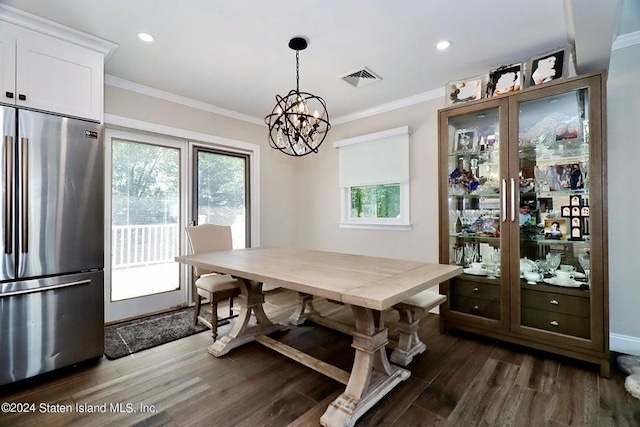 dining space with recessed lighting, dark wood-style floors, visible vents, ornamental molding, and a notable chandelier