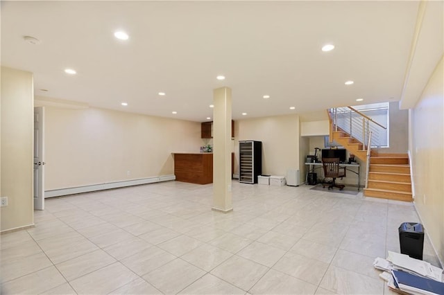 finished basement with recessed lighting, baseboards, baseboard heating, and stairs