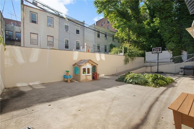 view of patio with area for grilling and a playground